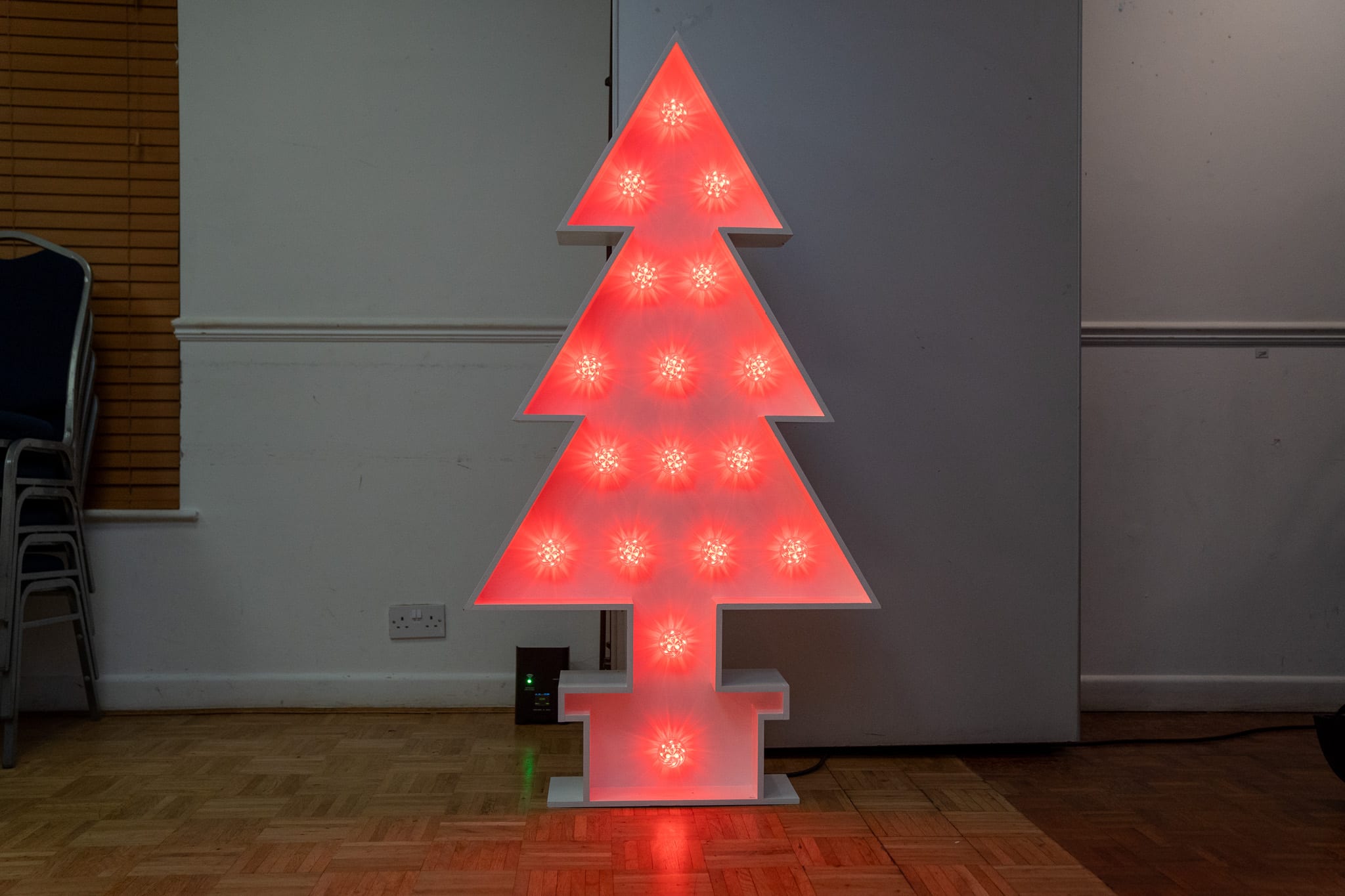 5ft light-up Christmas tree lit red at Aylesbury Tennis Club