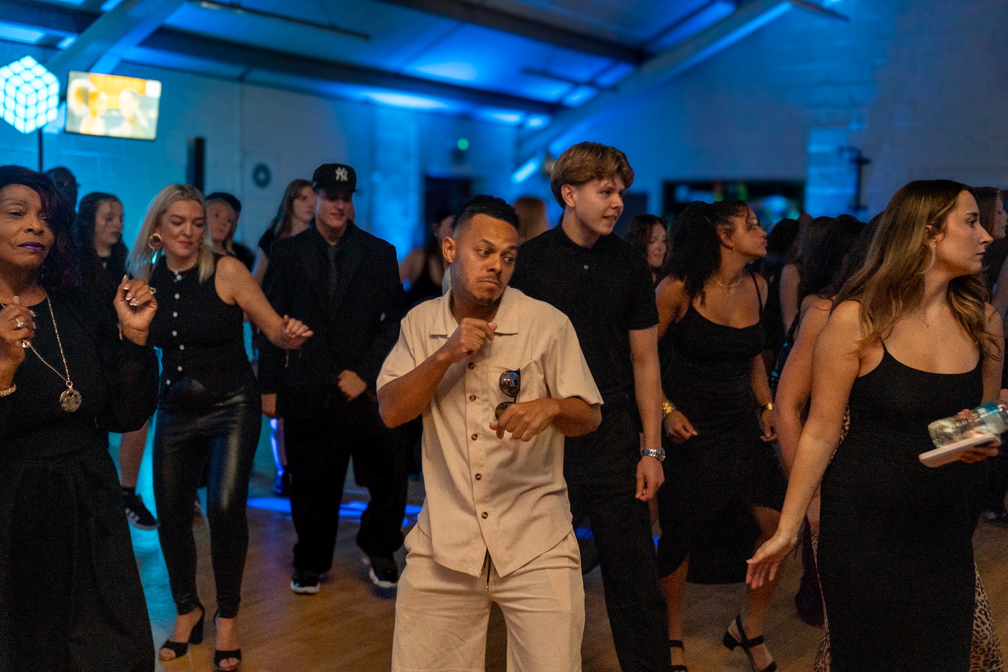 Friends dancing together at a birthday party