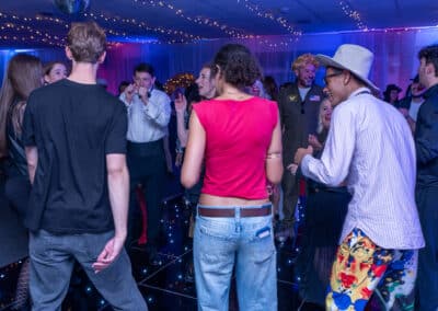 A full dance floor at a 60th birthday disco at Amersham & Chiltern Rugby Club