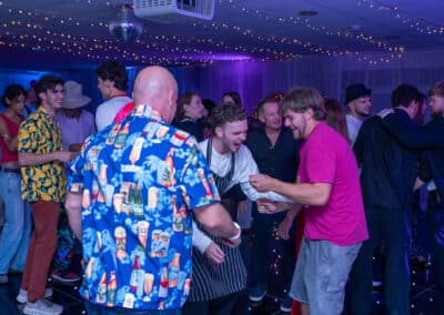 Group of friends enjoying a 60th birthday disco at Amersham & Chiltern Rugby Club