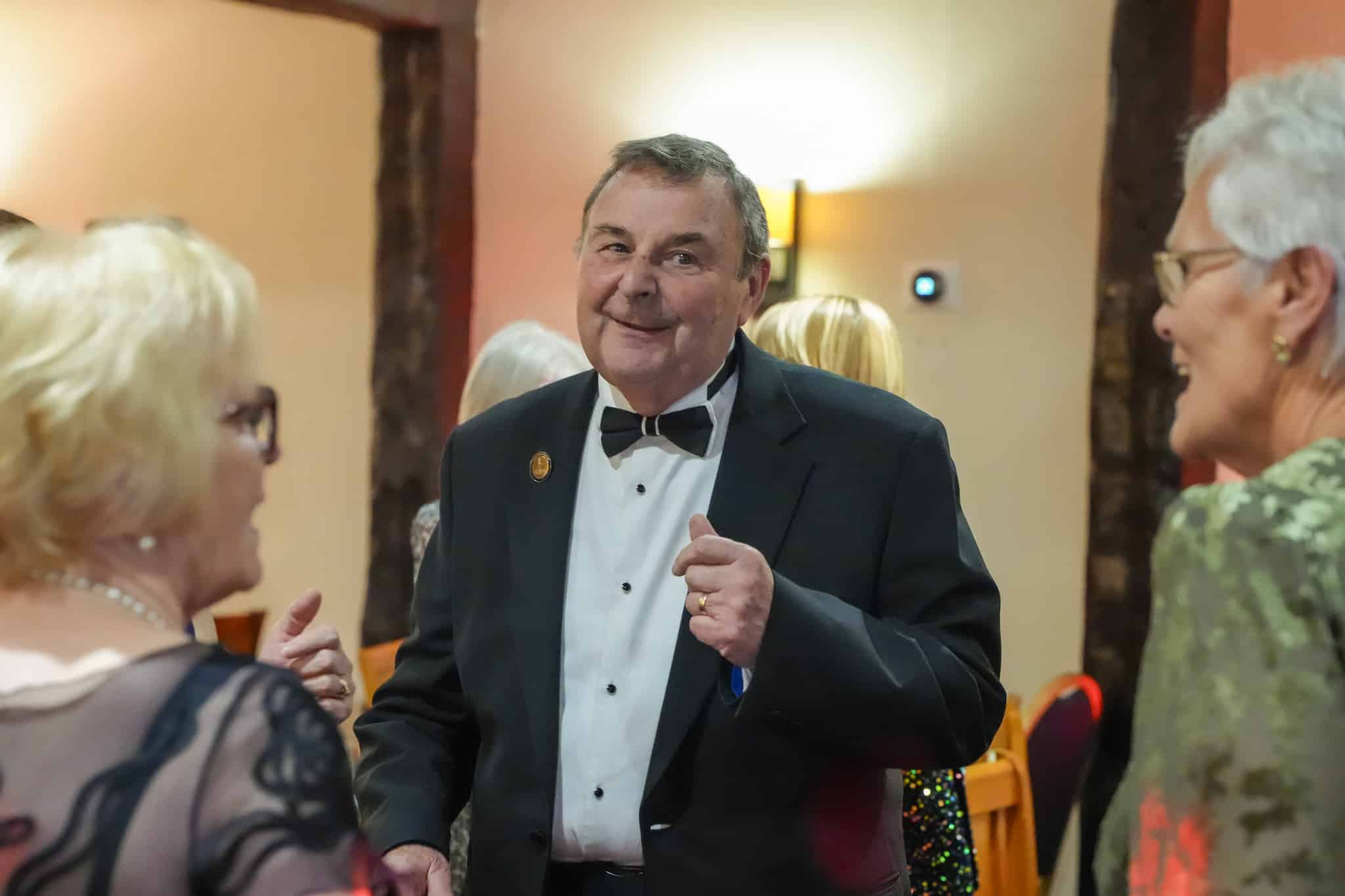 Choir member in black tie enjoying the West Wycombe Chamber Choir anniversary dinner