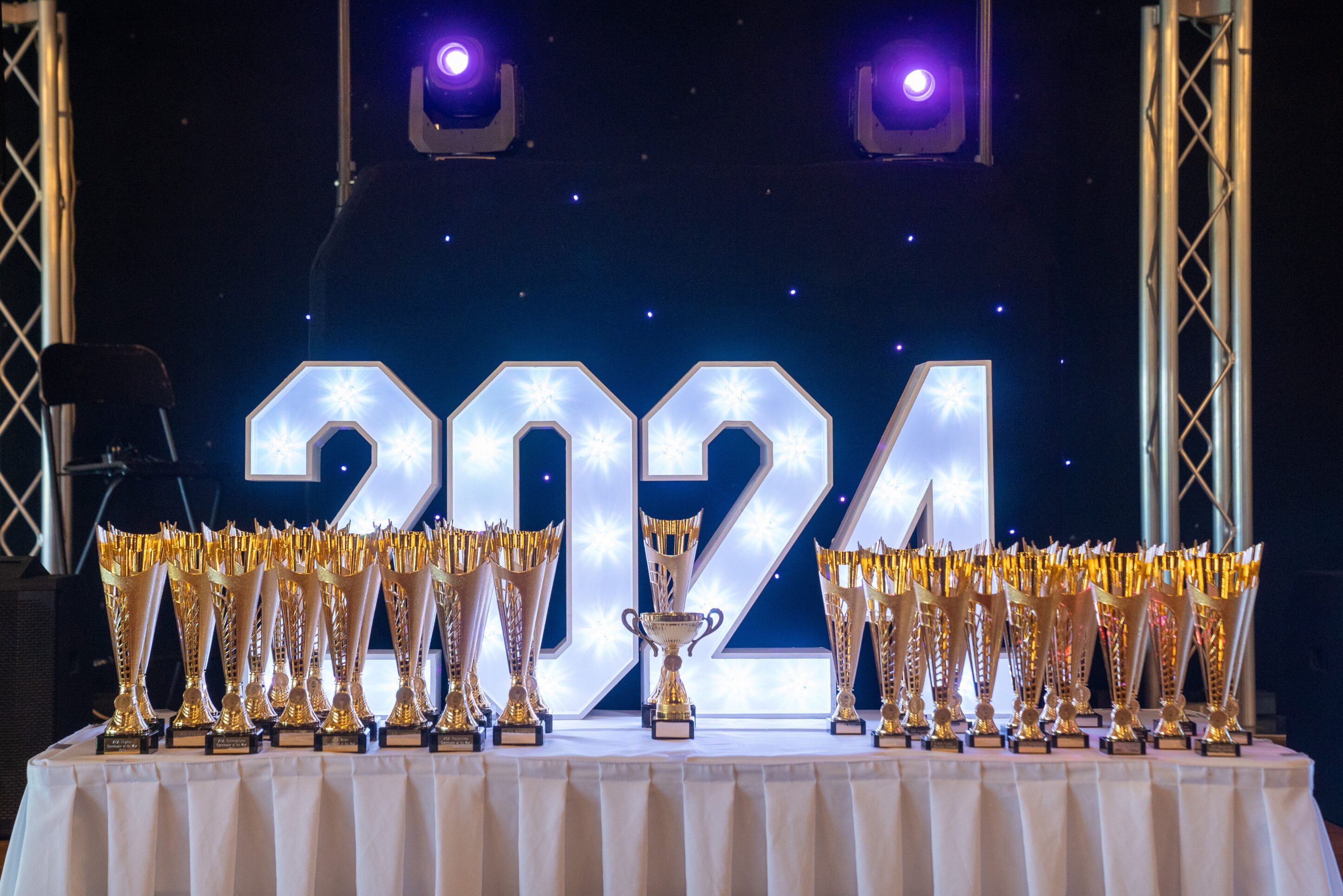 Trophies and light-up numbers set up for an awards night in Buckinghamshire