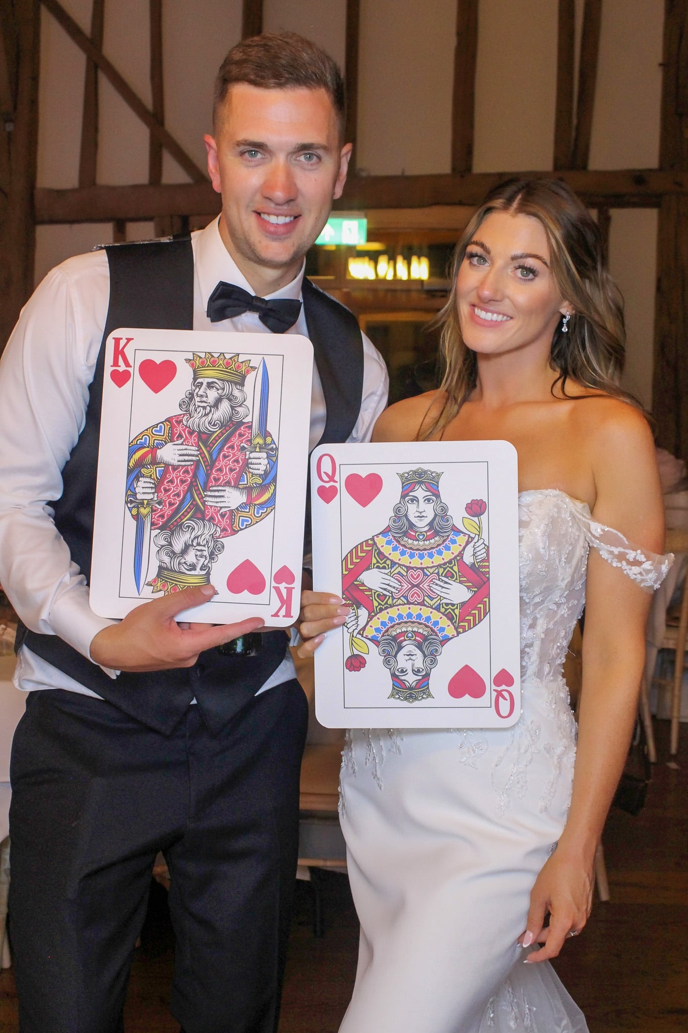 Bride and groom with king and queen photo booth props