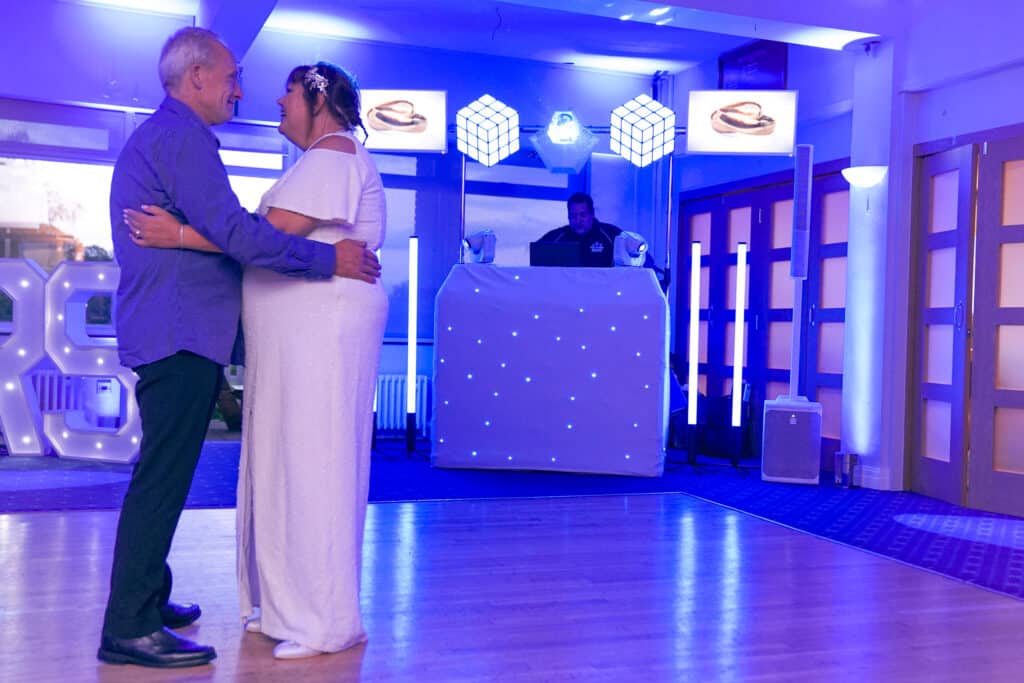 Jim and Carol&rsquo;s first dance in blue light at Grim&rsquo;s Dyke Golf Club — Fill The Floor Discos
