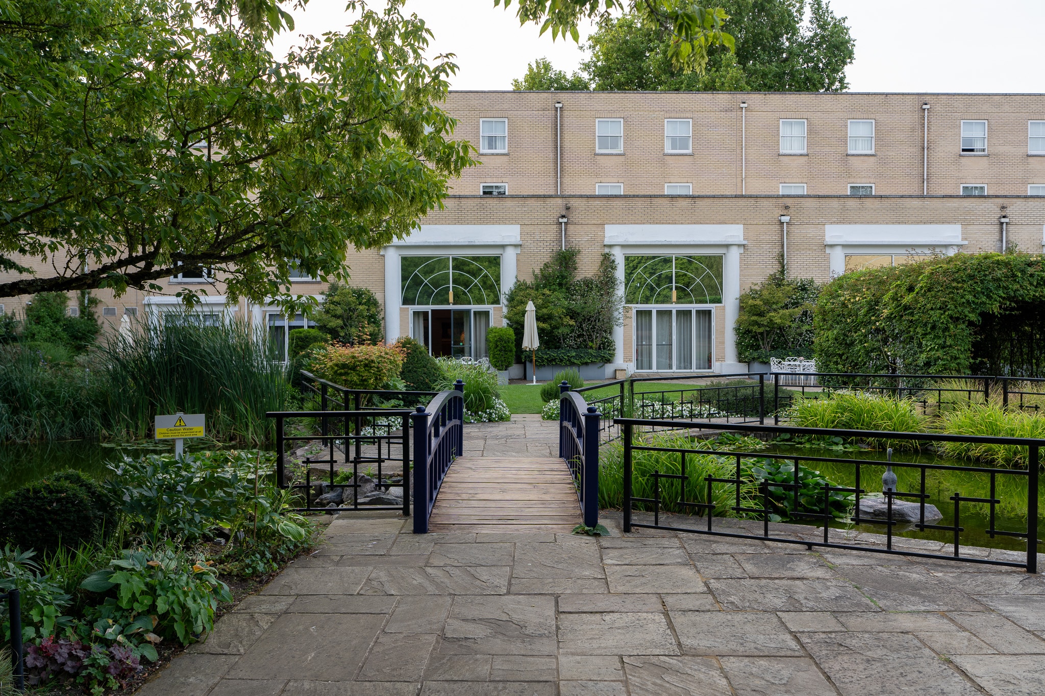 The garden path and bridge leading to the St Alban Suite doors at Sopwell House