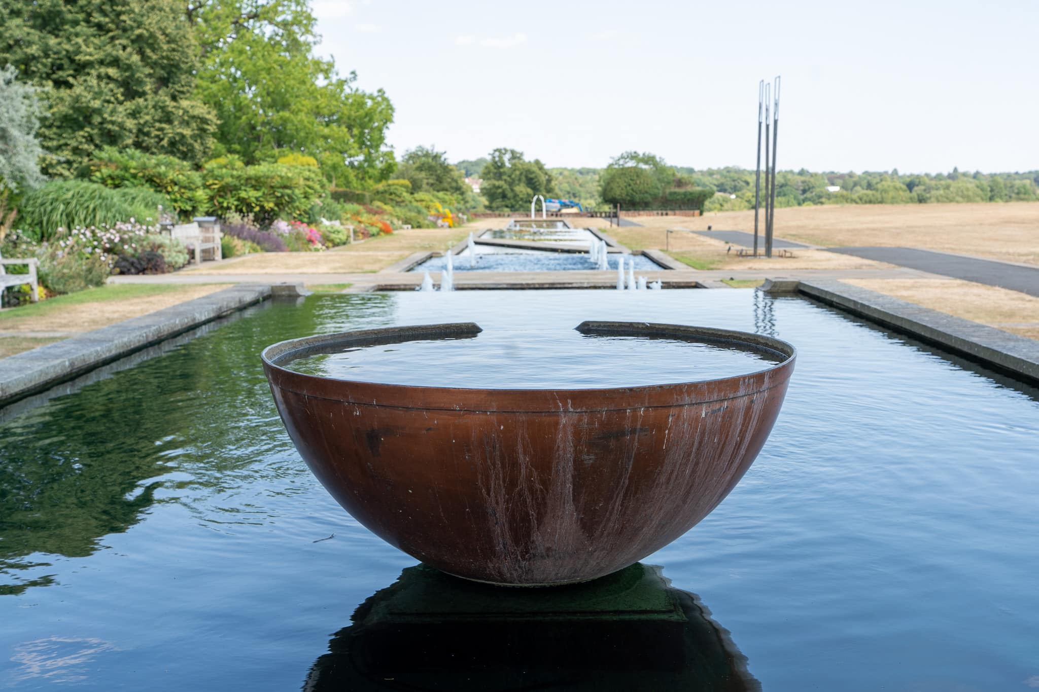 The rill and copper-bowl water features in the gardens at The Grove