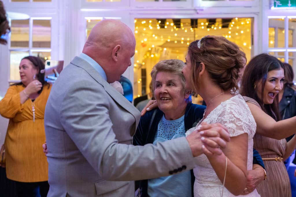 Family and friends dancing at a London Shenley Club wedding