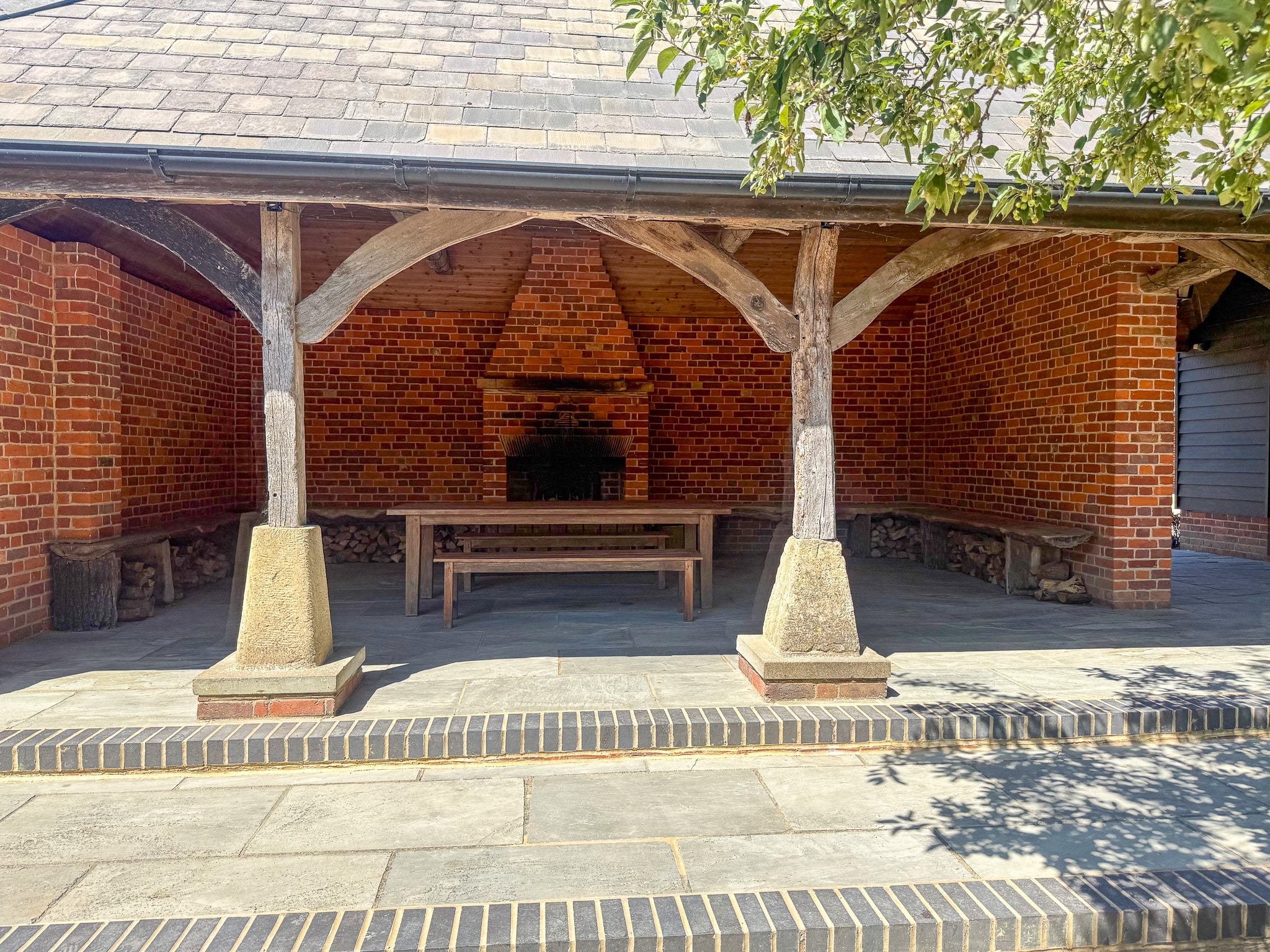 Brick garden pavilion with open fireplace at Micklefield Hall