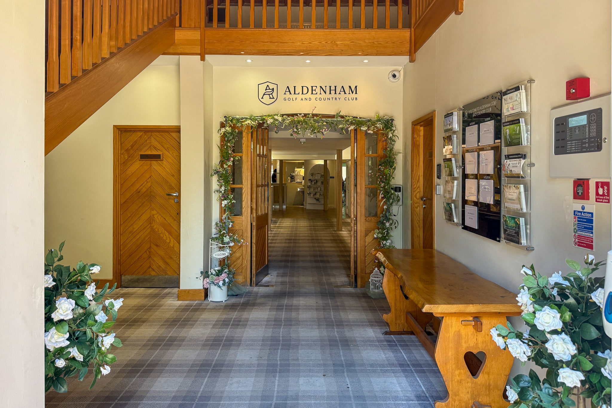 The oak corridor dressed with garlands inside the clubhouse at Aldenham Golf and Country Club